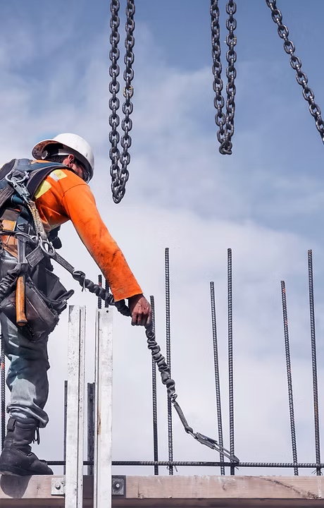 A construction worker engineering a bridge structure.